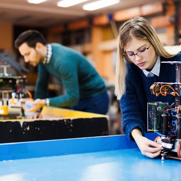 young-student-of-robotics-working-on-project-S32GWUC-637x637